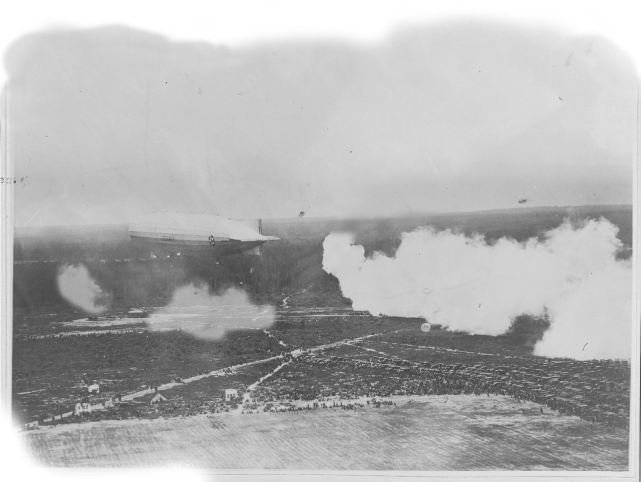 The Zeppelin being fired at by shells filled with mustard gas.